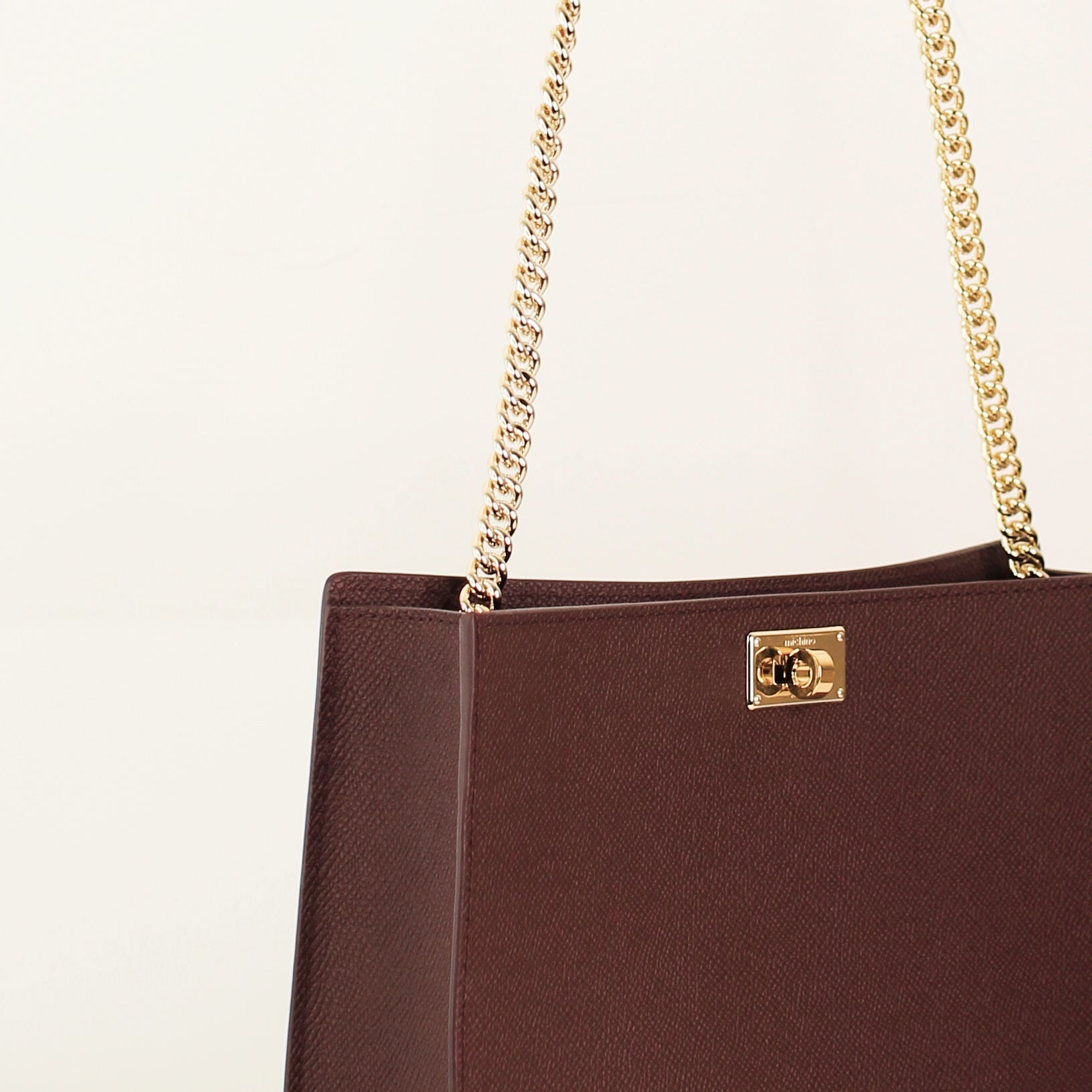 POCHETTE MONTAIGNE IN LEATHER PRUNE